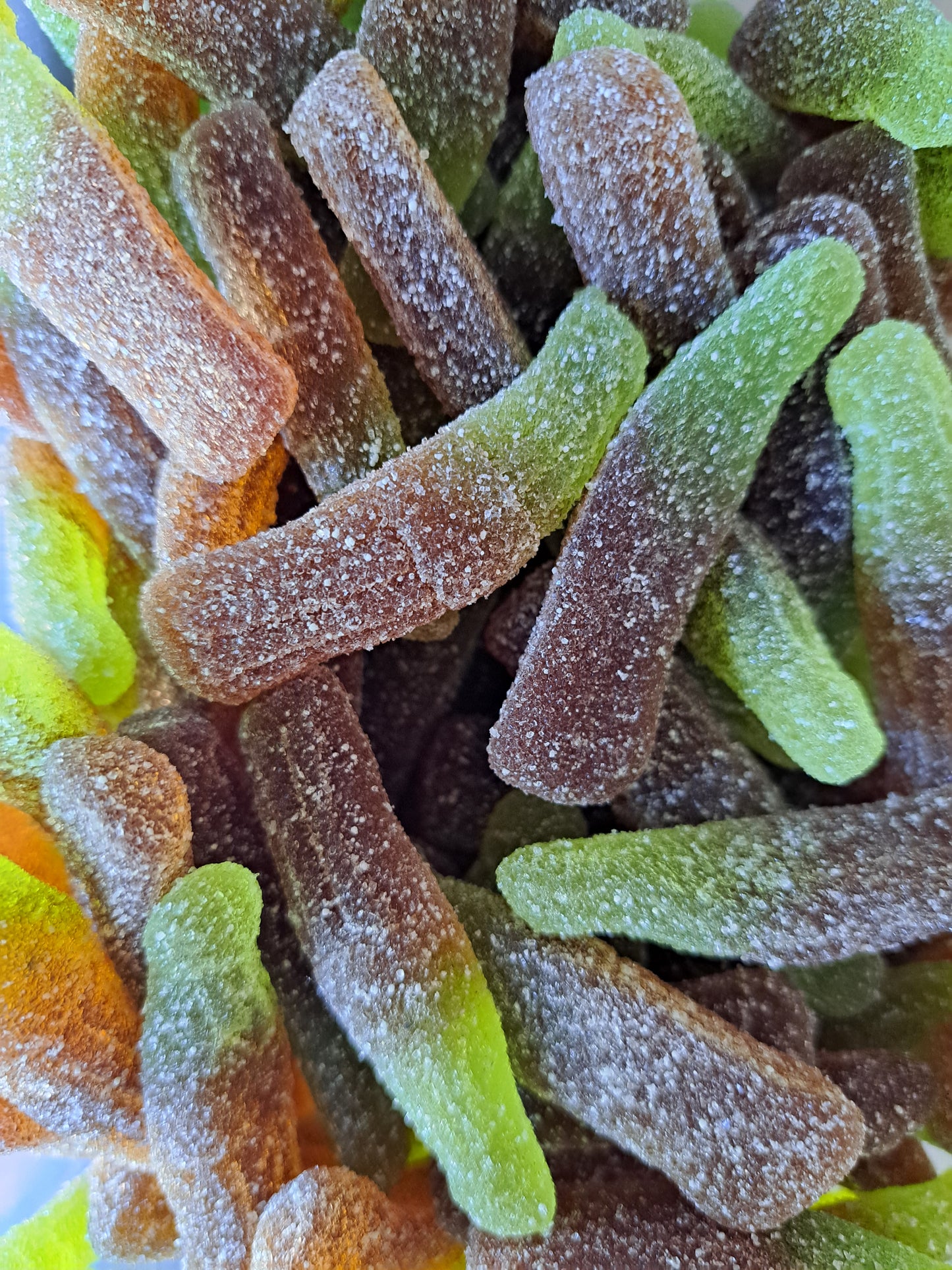 Bouteilles de cola acidulées